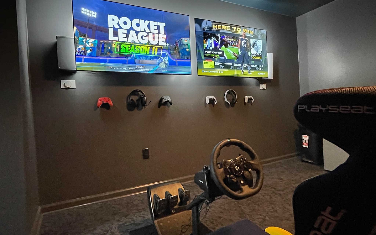 Game room with controllers on wall